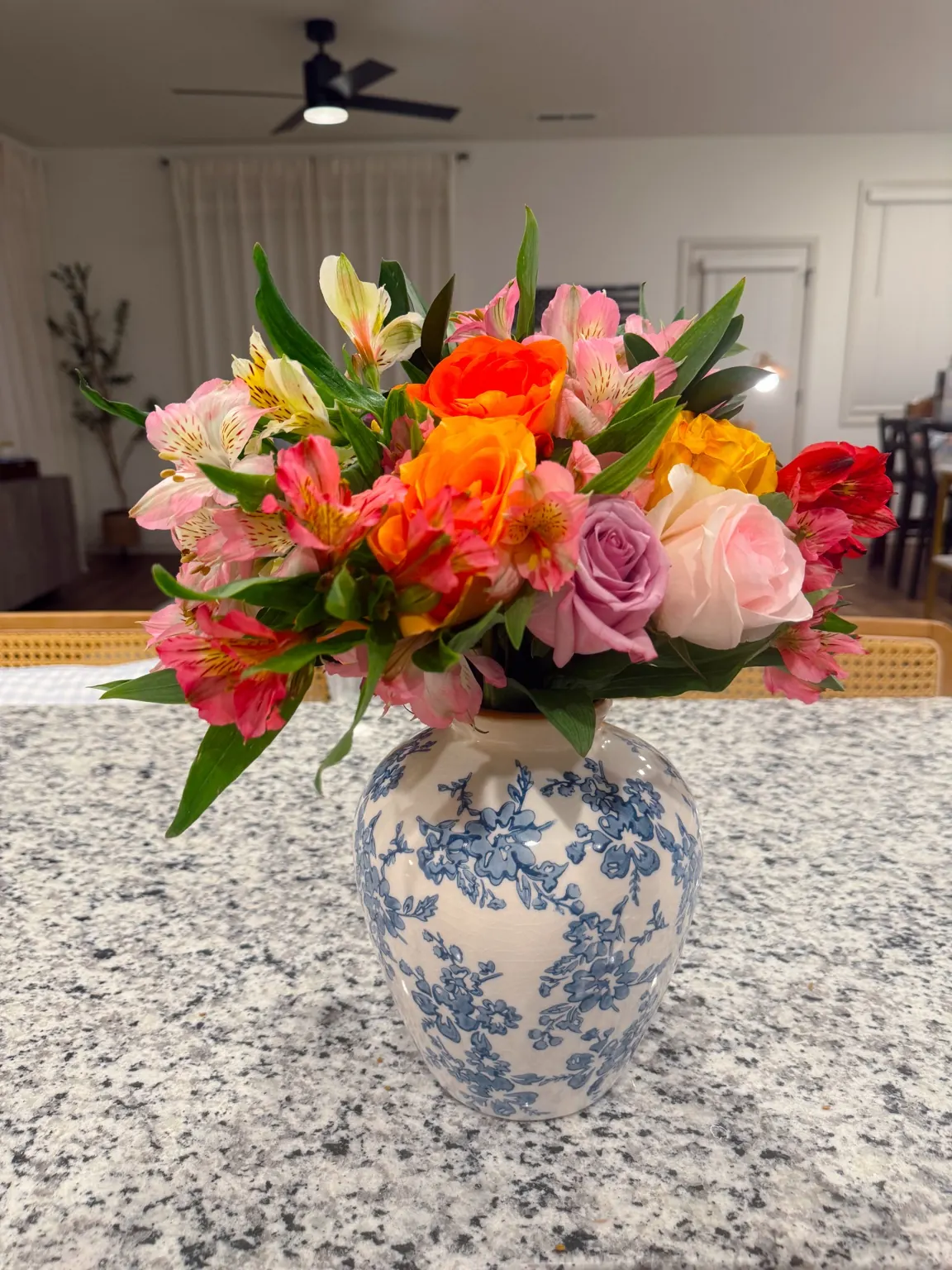 Fresh flowers in Lo’s blue-and-white vase at home